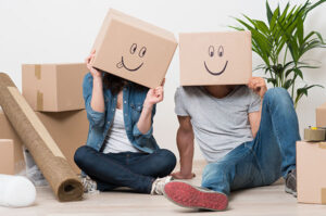 Couple,With,Cardboard,Boxes,On,Their,Heads,With,Smiley,Face
